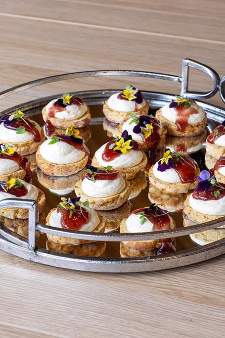 Afternoon tea food option on silver serving plate.